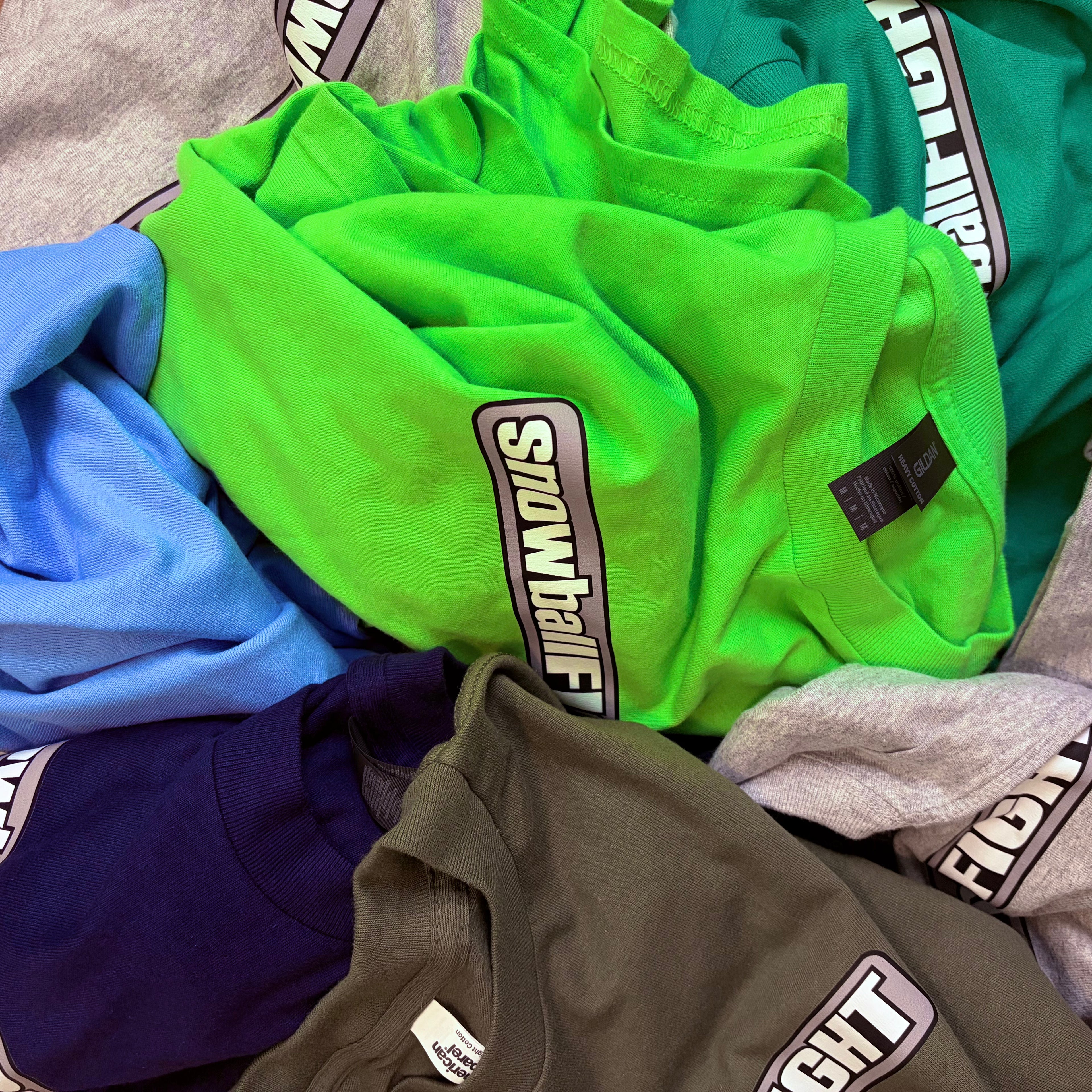 Random Color Snowball Fight Logo Tee